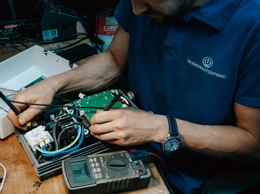 Technician using tools during a service visit